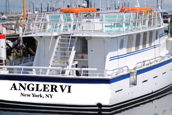 a boat is docked next to a body of water